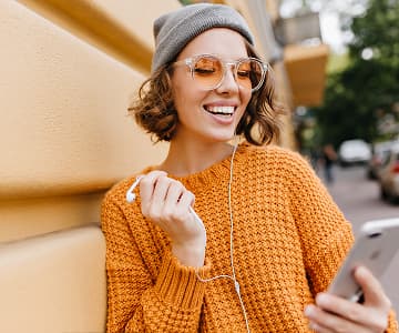 A woman that looks at a smartphone